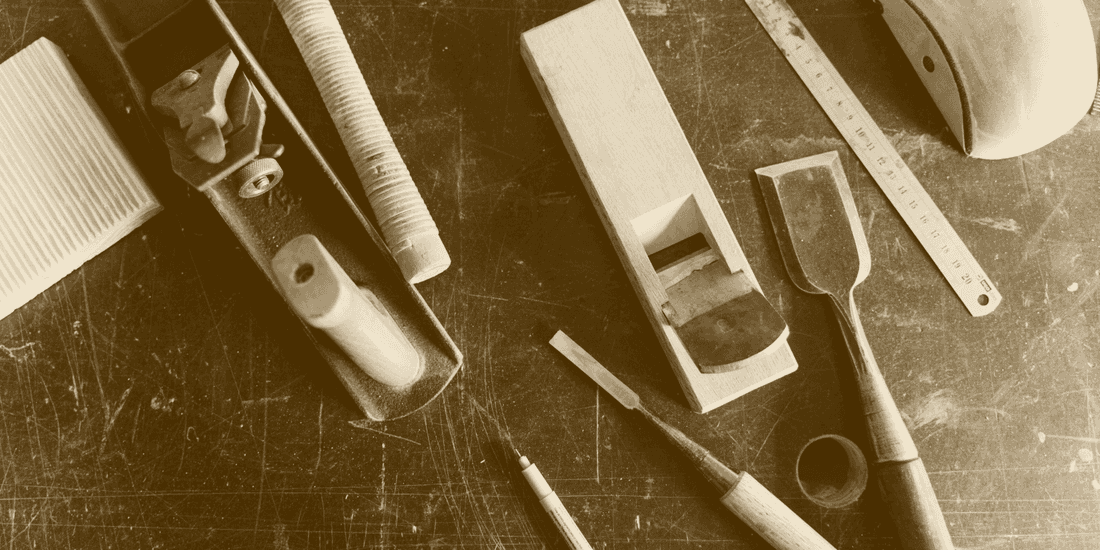 Bench tools laid out on a worn top, printed in one ink.